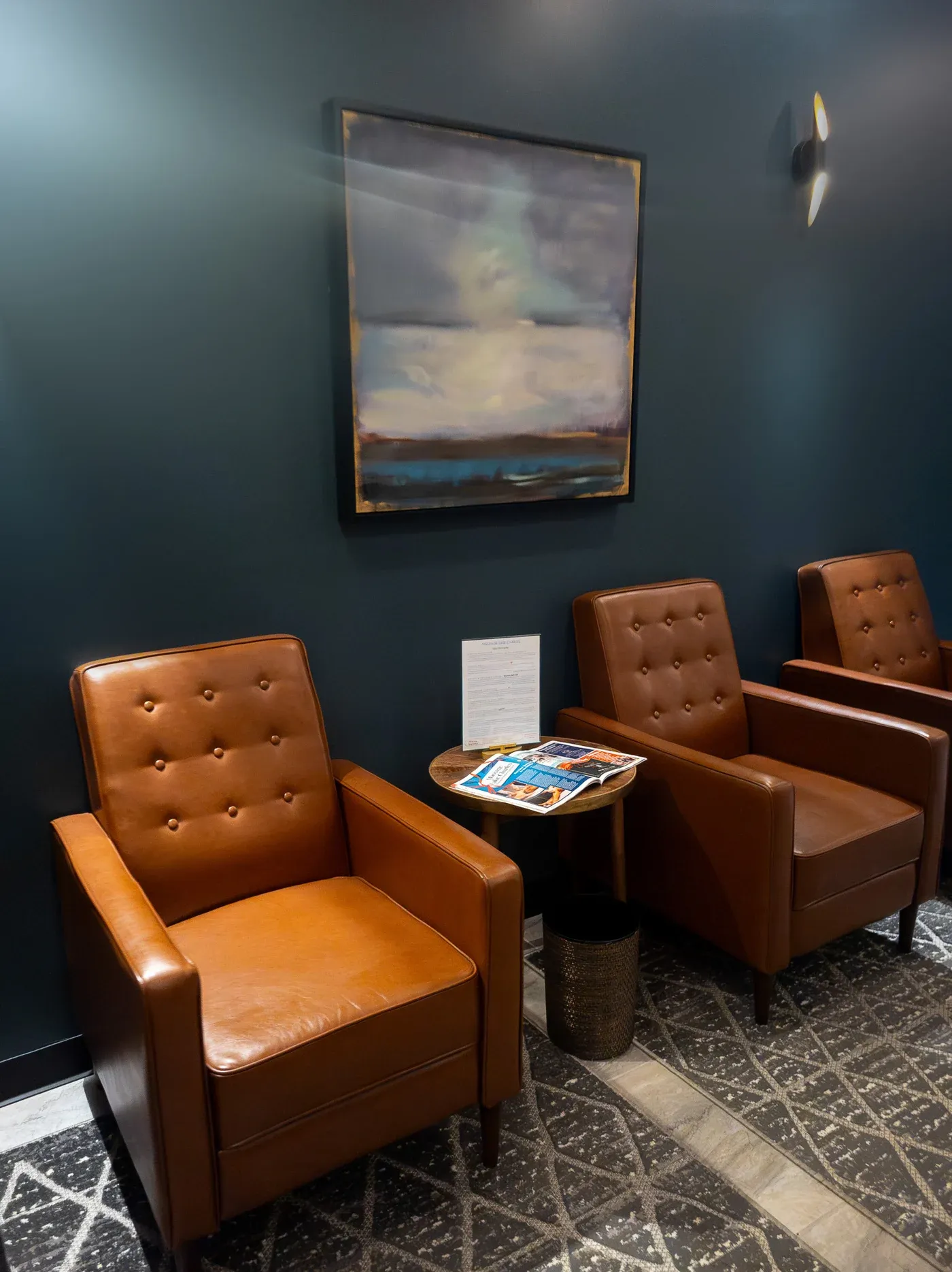 Seating and framed artwork in a waiting room