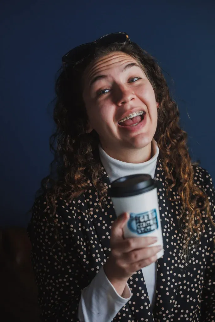 Laughing portrait holding a cup