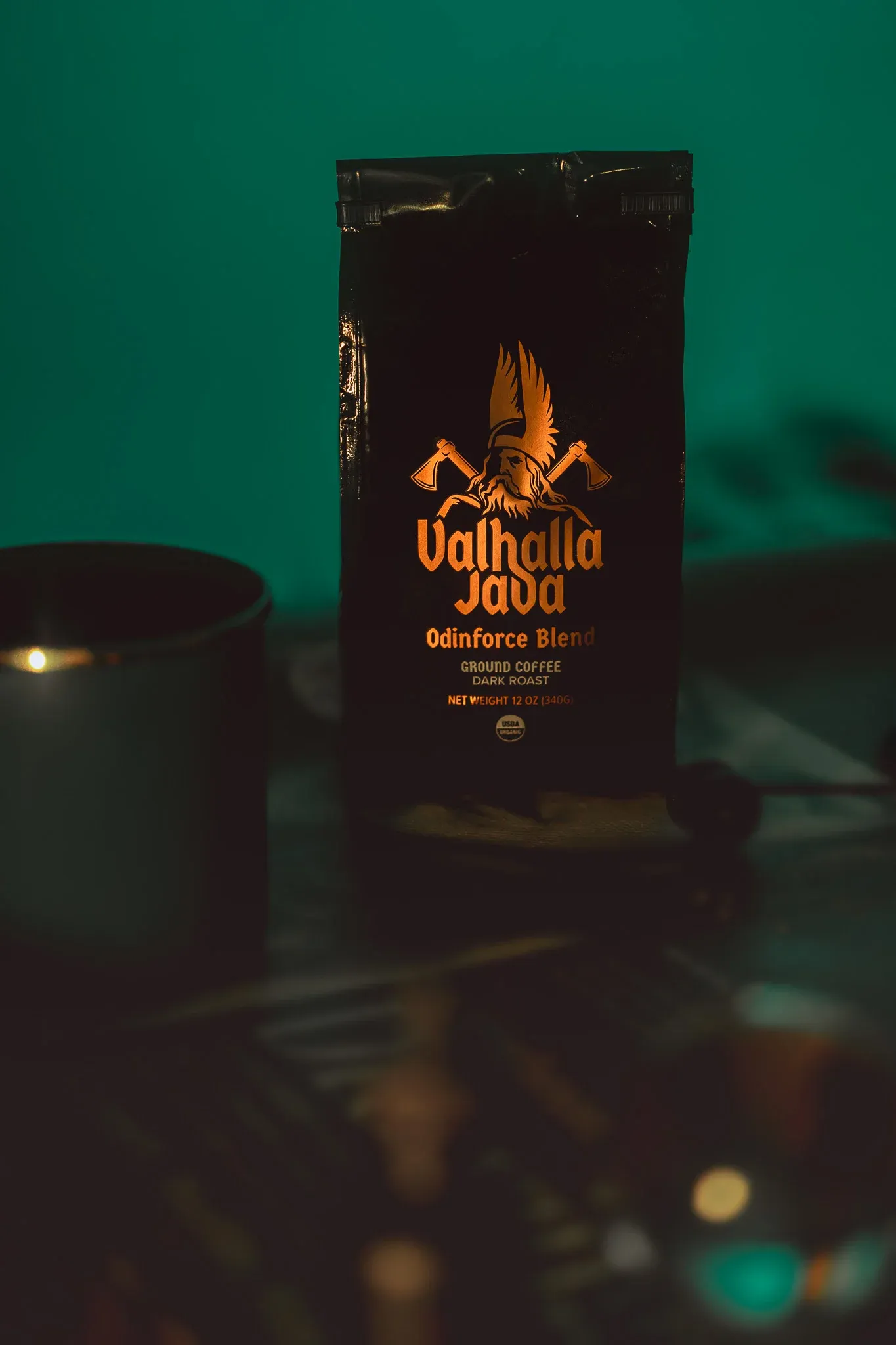 Product photograph of a boxed fragrance in moody light
