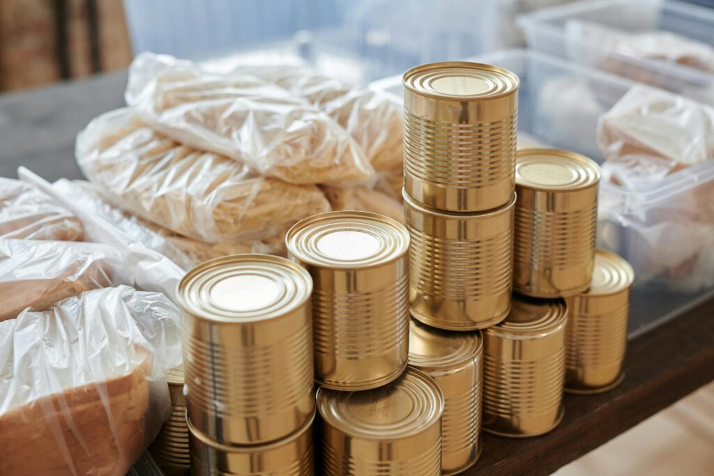Canned goods and packaged bread prepared for distribution at a food bank.